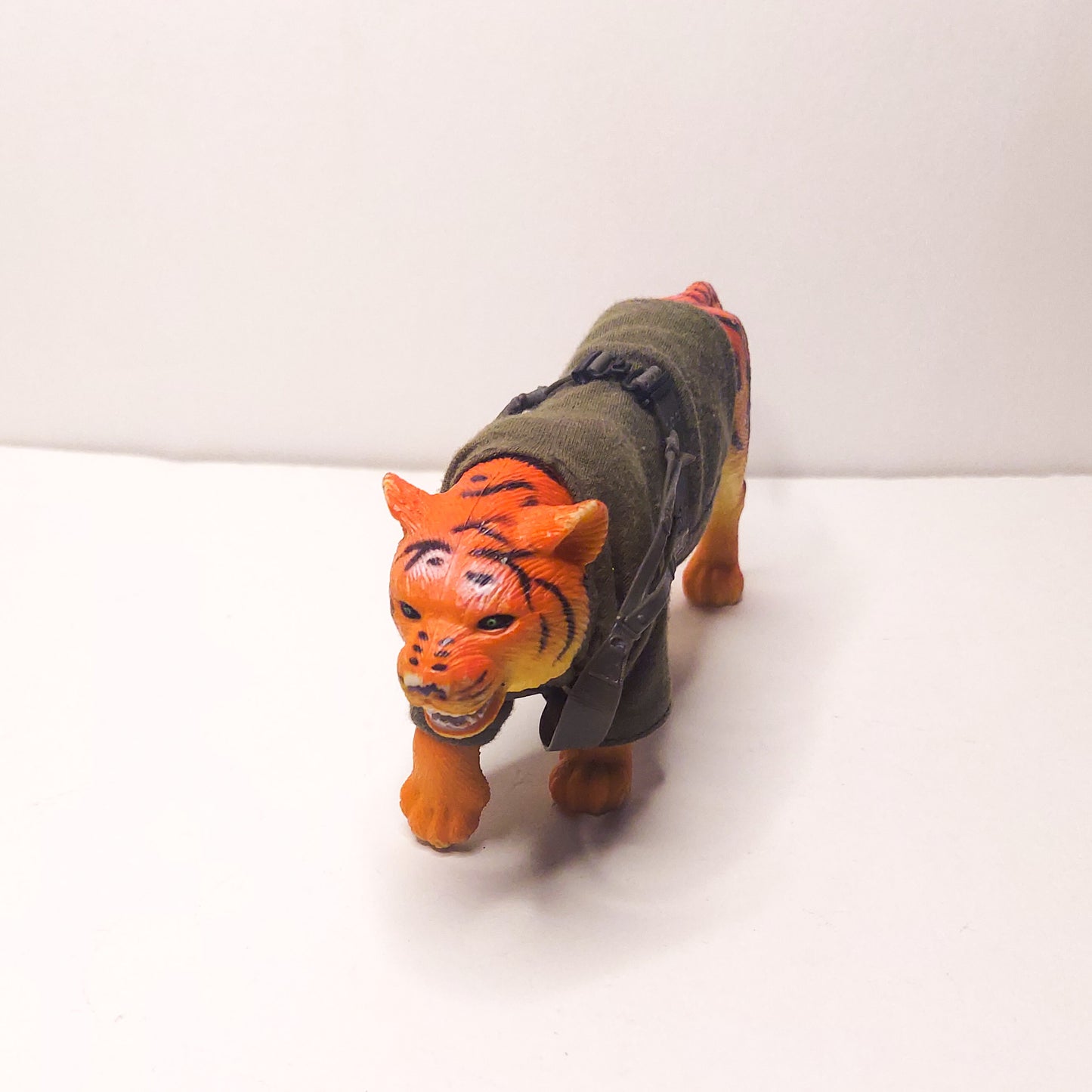 plastic tiger with cloth sweater