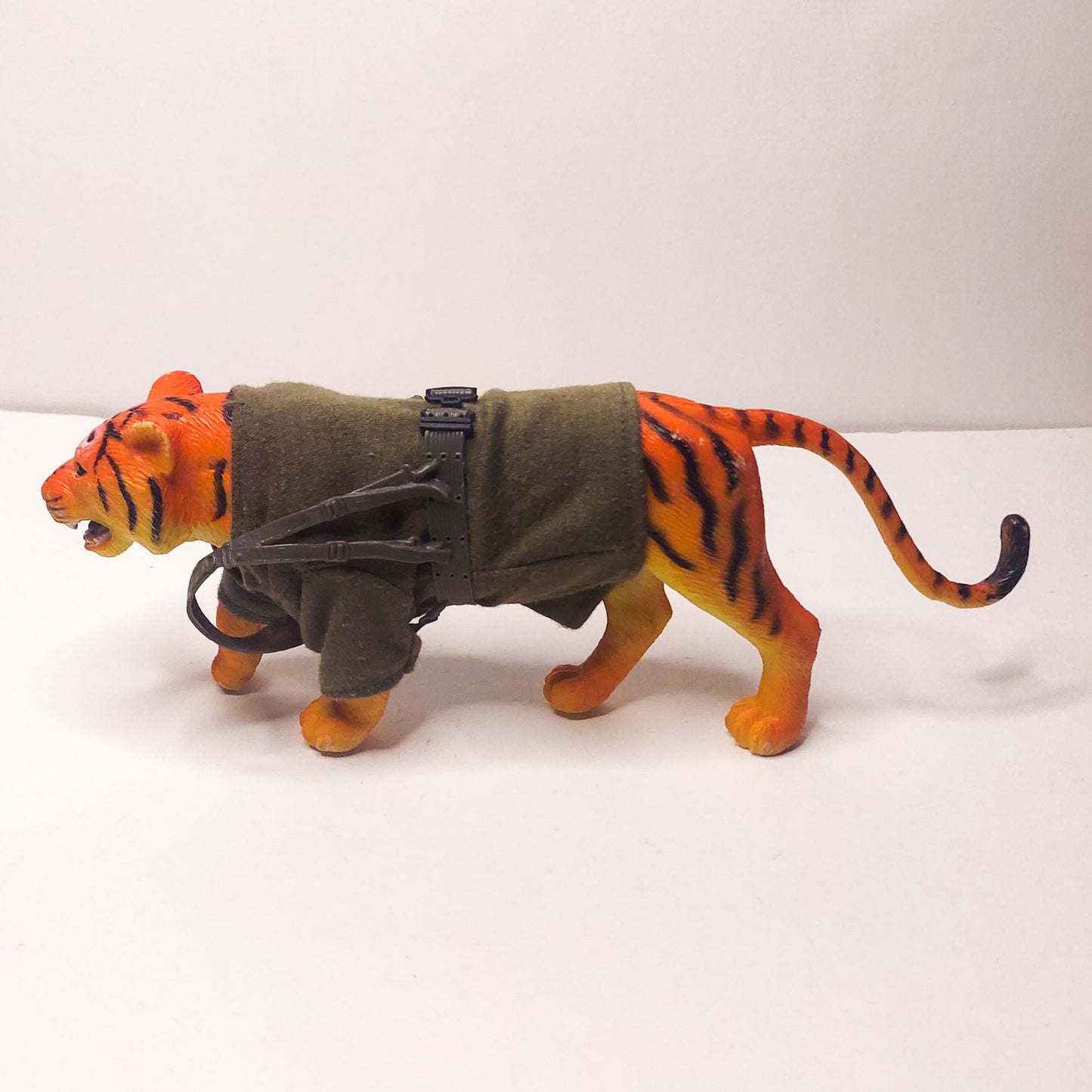 plastic tiger with cloth sweater