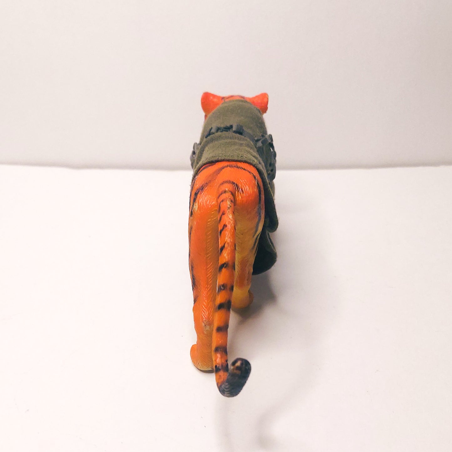 plastic tiger with cloth sweater