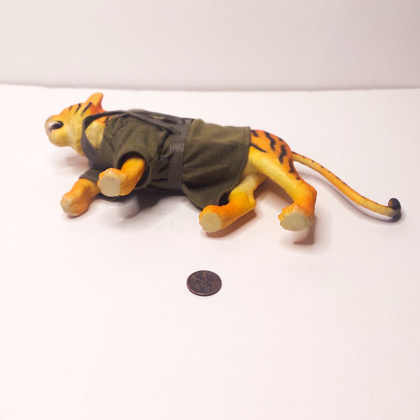 plastic tiger with cloth sweater