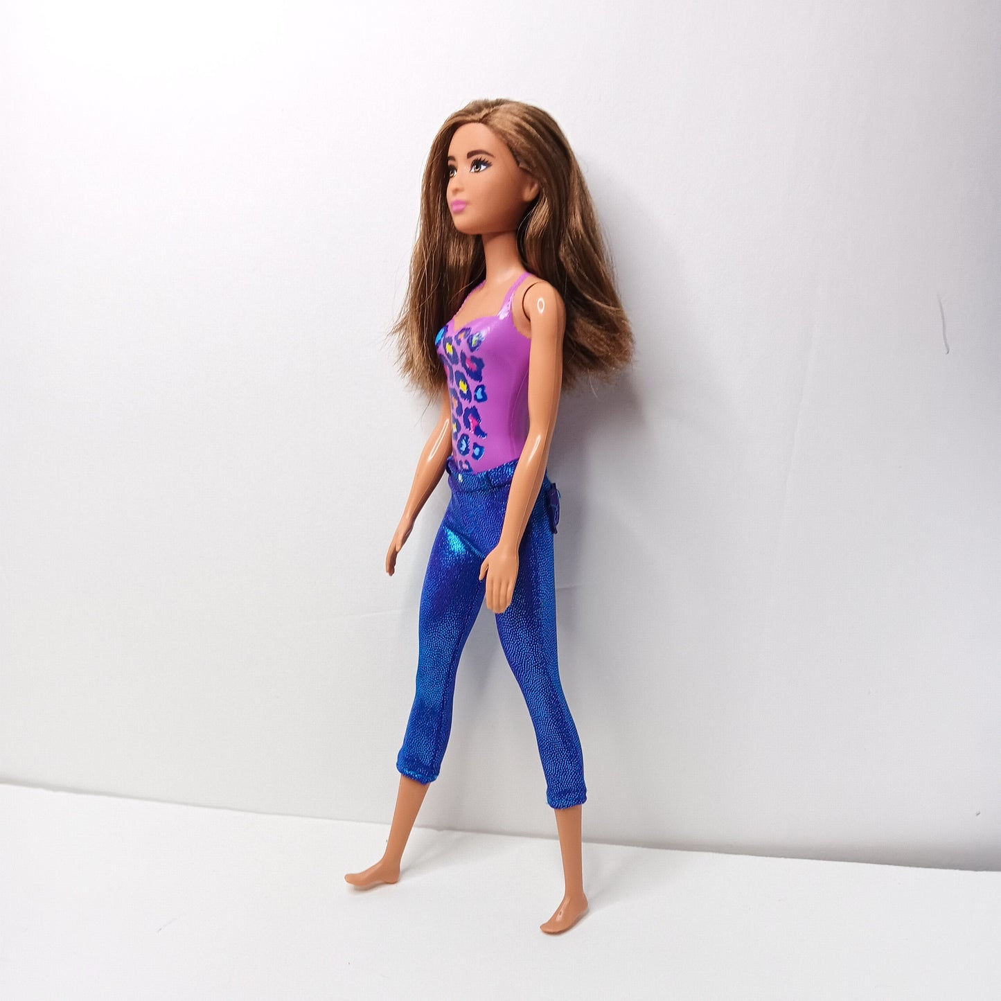 BARBIE DOLL- LONG BROWN HAIR WEARING PURPLE MOLDED-ON SWIMSUIT