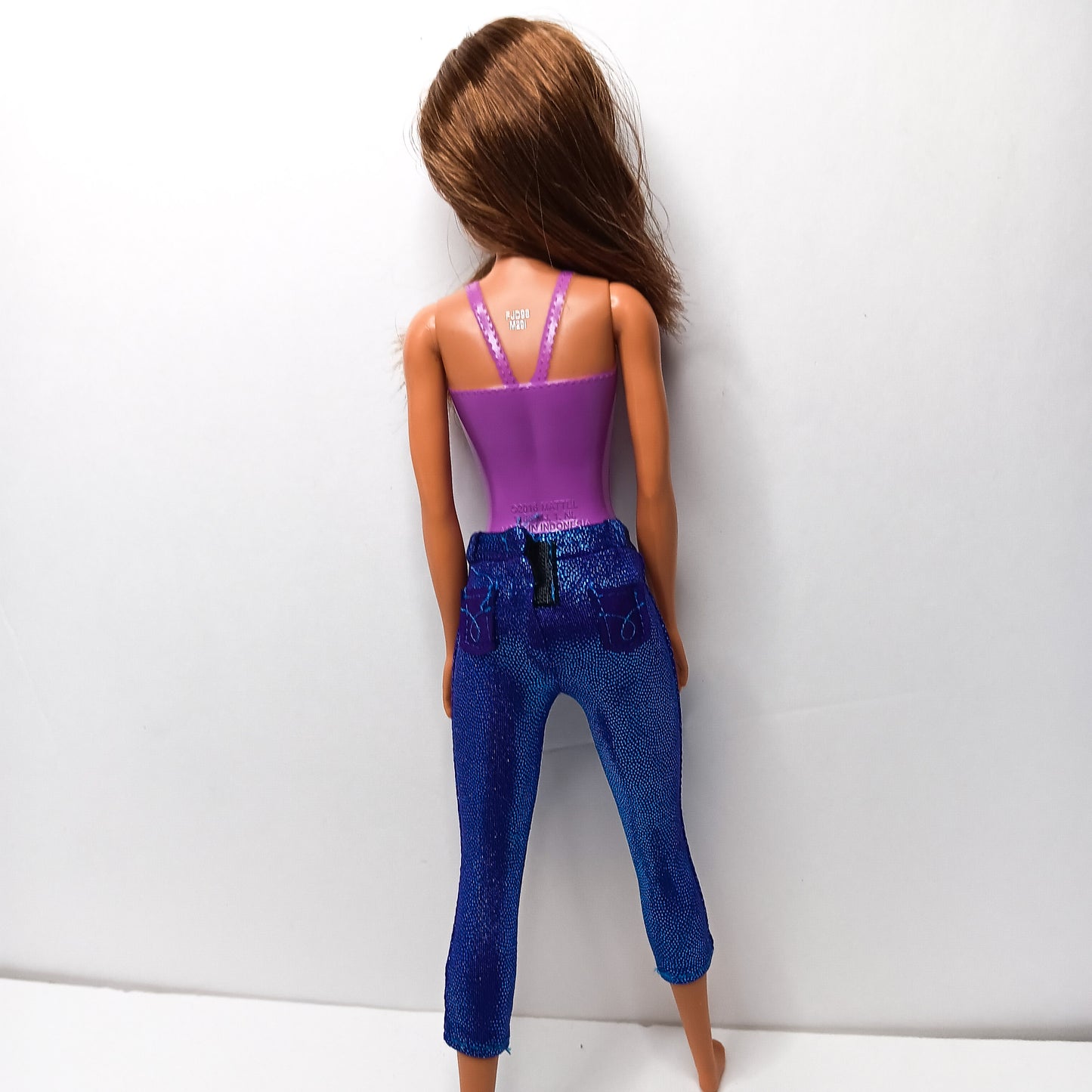 BARBIE DOLL- LONG BROWN HAIR WEARING PURPLE MOLDED-ON SWIMSUIT